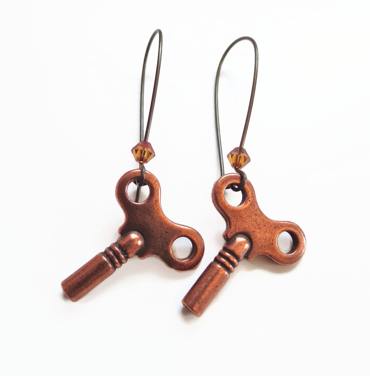 Kay - copper wind up key earrings