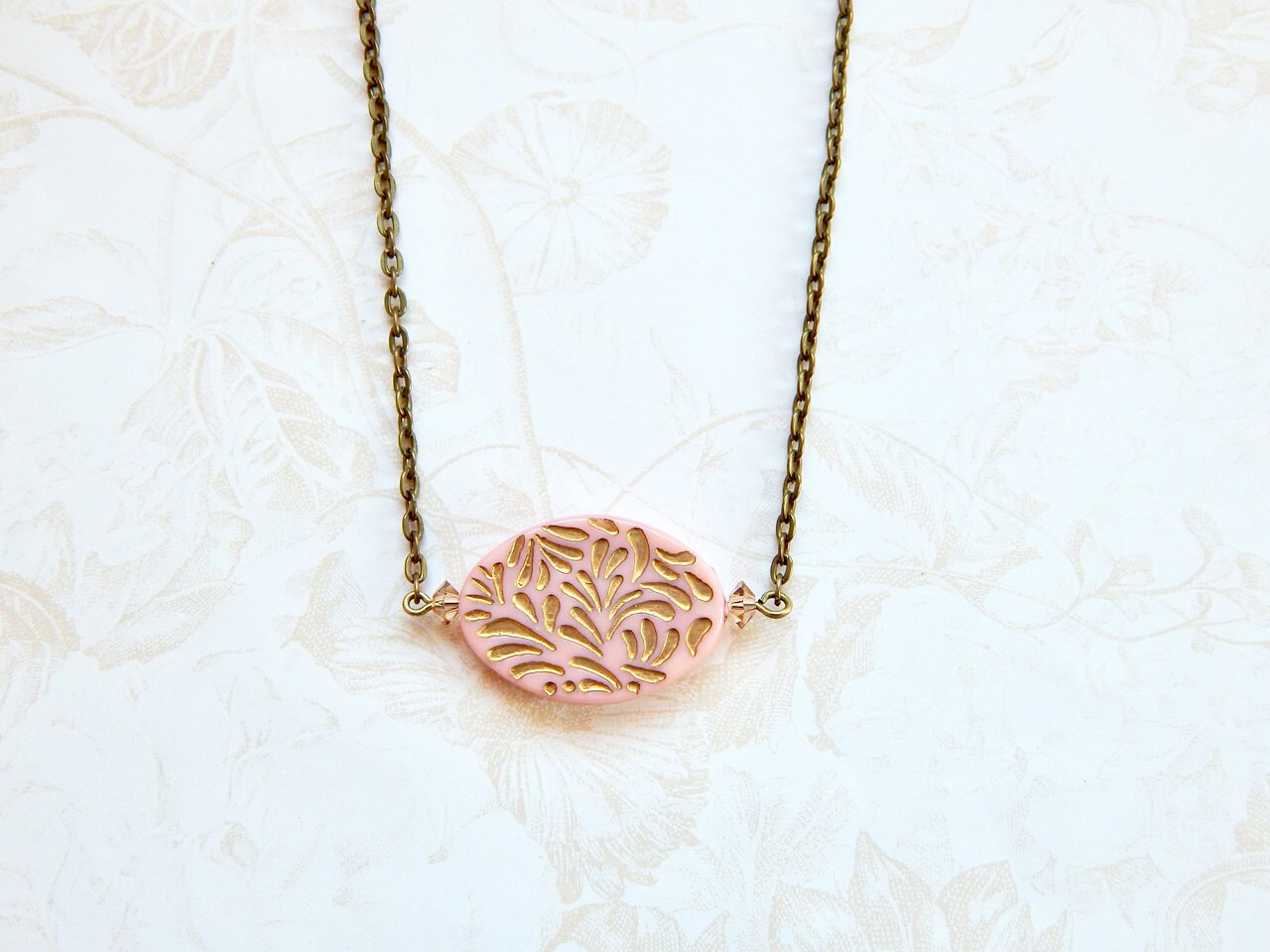 Gold etched pendant necklace in pink or blue