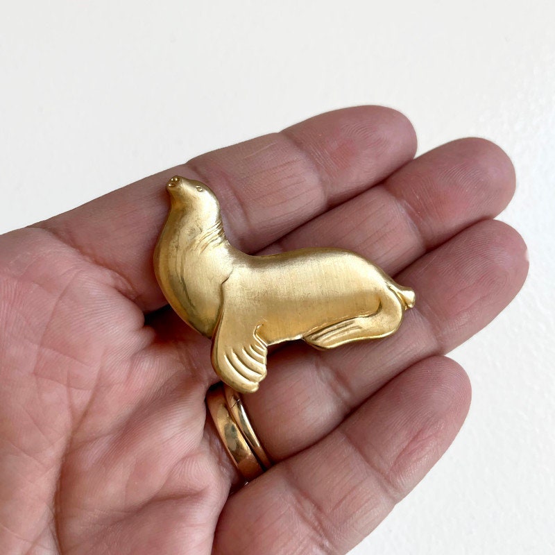 Fred - vintage brass seal brooch