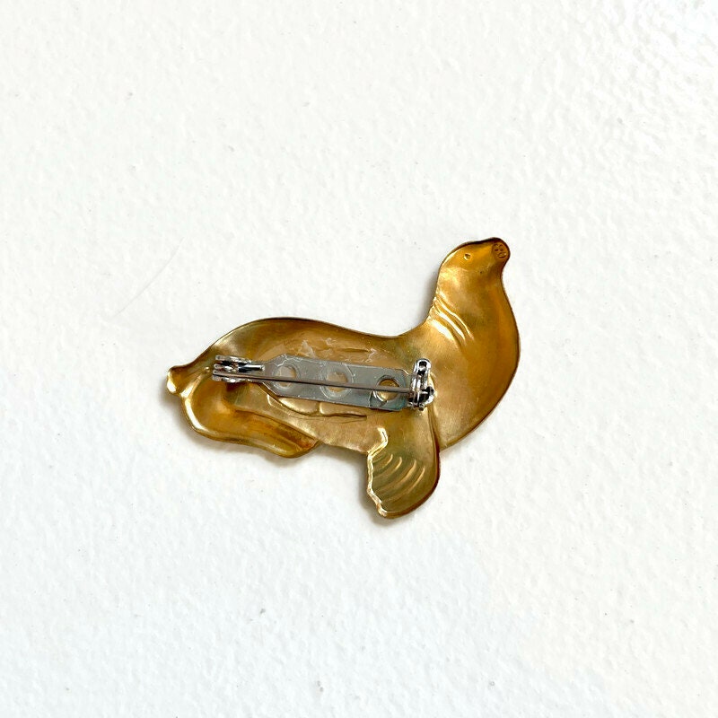 Fred - vintage brass seal brooch