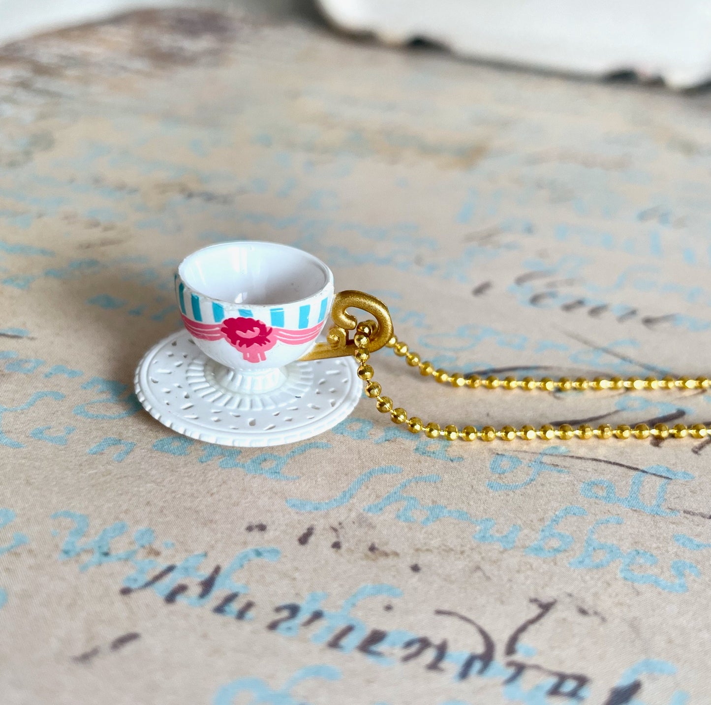 Miniature white and pink teacup necklace